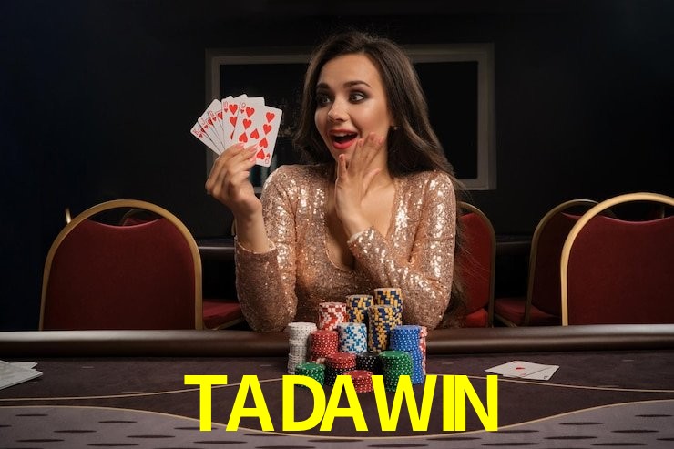 Una escena digital vívida inspirada en casino con TADAWIN mostrado prominentemente, luces brillantes, fichas, cartas y acentos dorados.